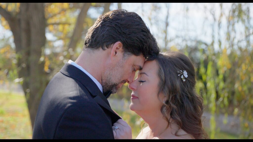 Bride and groom sharing a quiet moment outdoors in a wedding film by MrHolmes Media.