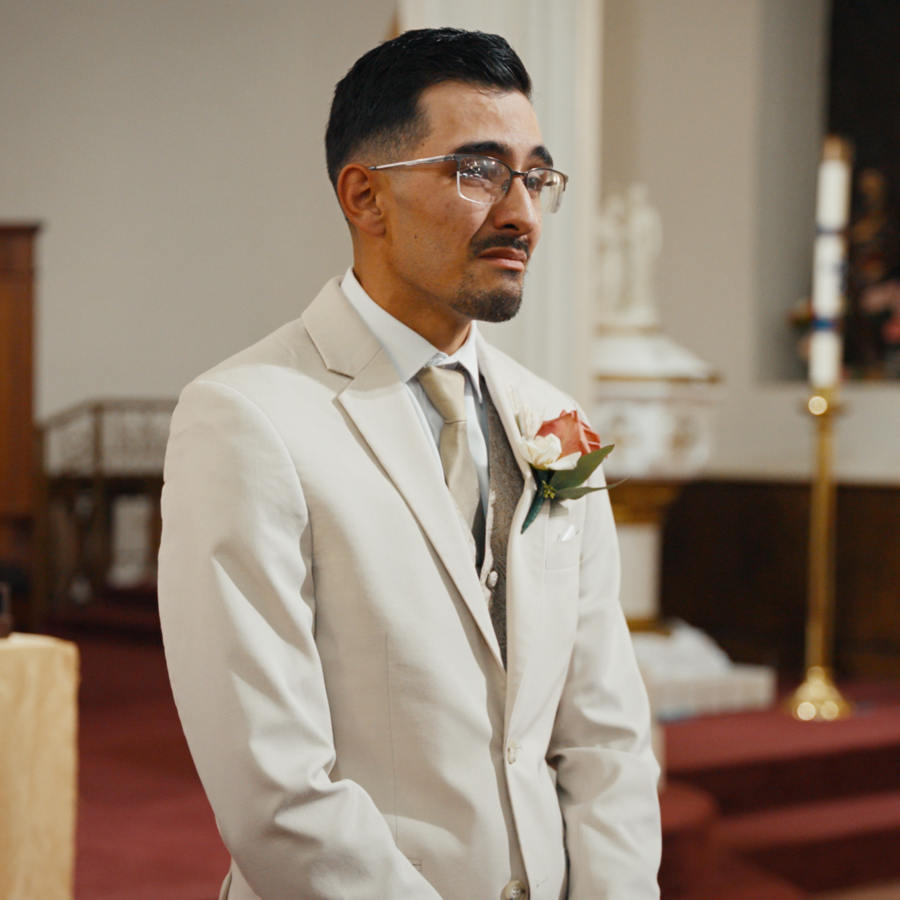 Groom waiting at the altar during a church wedding ceremony