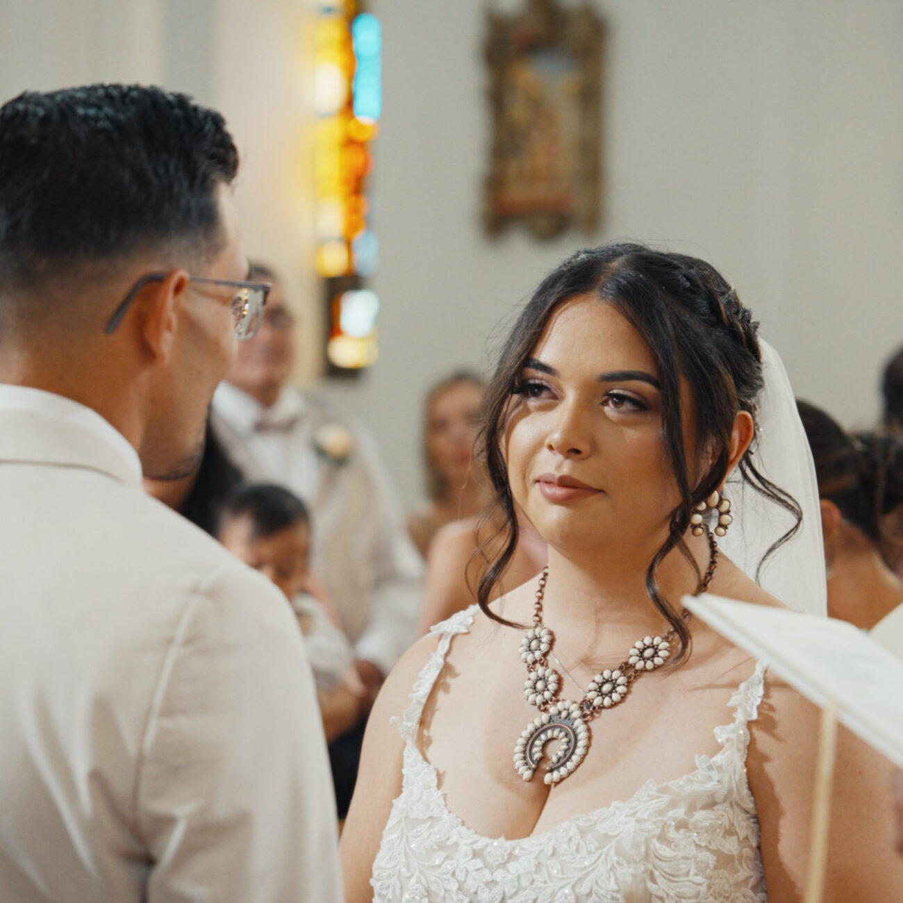 Bride and groom exchanging vows during their church wedding ceremony