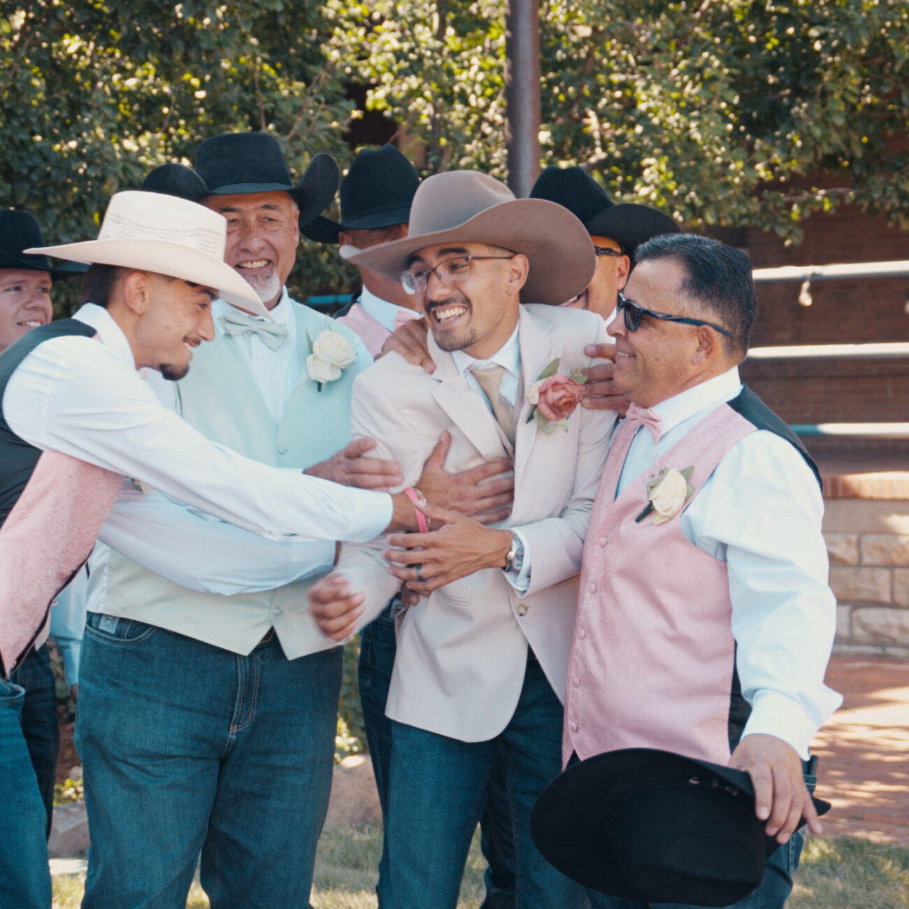 Groom celebrating with his groomsmen on his wedding day